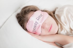 female sleeping with beauty mask