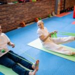 older man and woman exercising