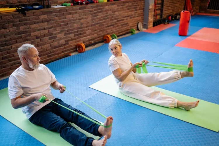 older man and woman exercising